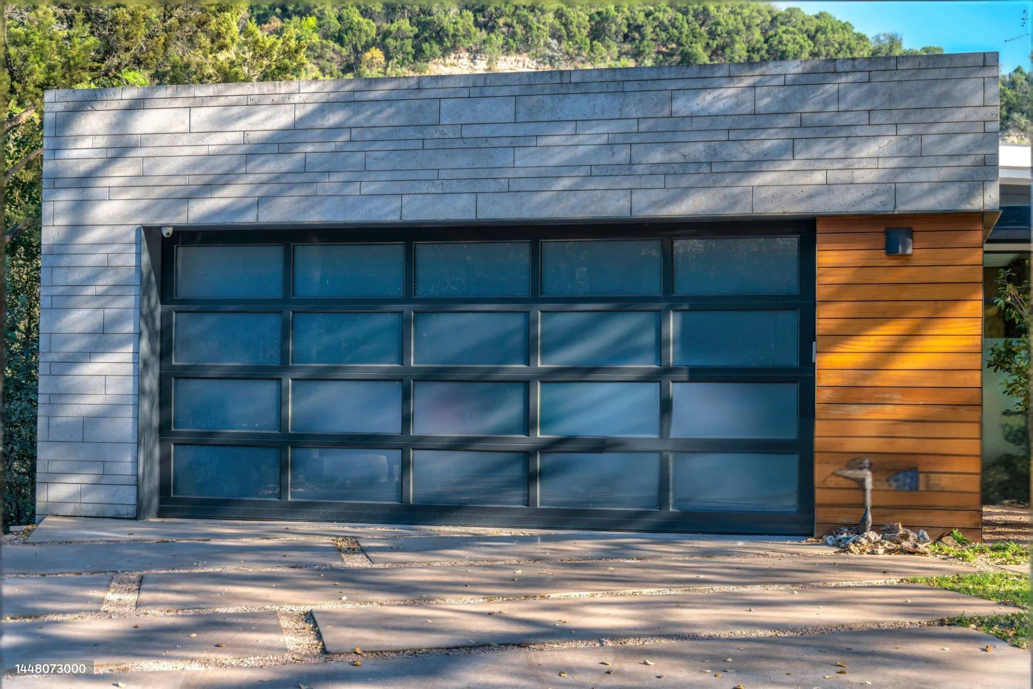 Modern Glass Garage Door with Black Aluminum Frame for Contemporary Residential and Commercial Building Applications