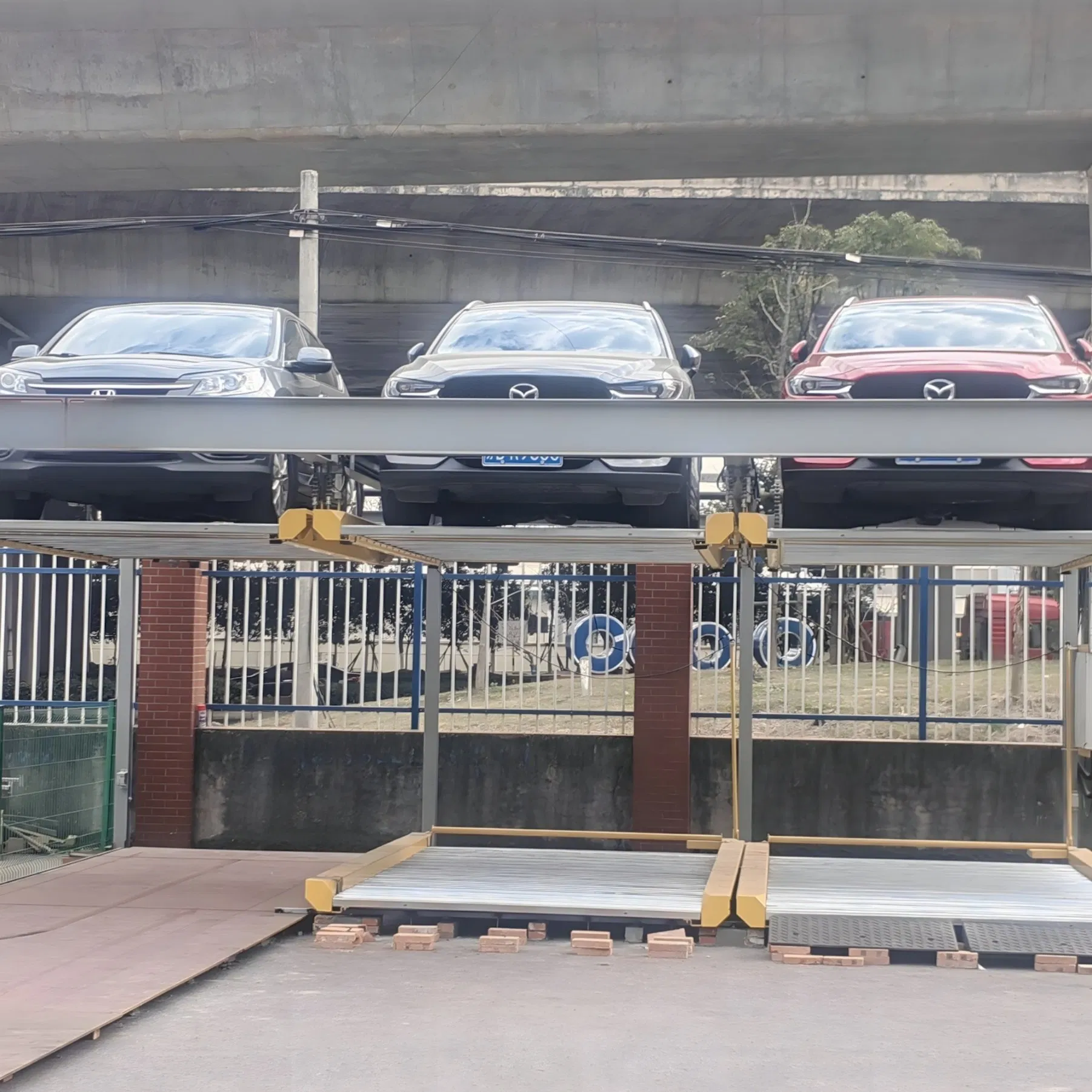 Compact Puzzle Parking System Designed with Modular Steel Frames to Double Parking Capacity in Limited Areas