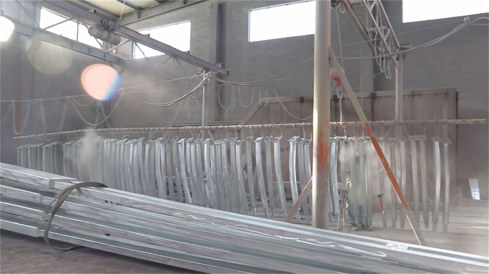 Electrostatic powder coating and fluorocarbon paint spraying on lighting poles