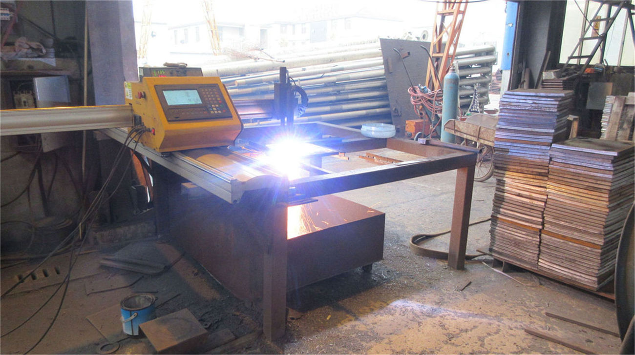 CNC laser cutting machine processing steel sheets for solar street light poles