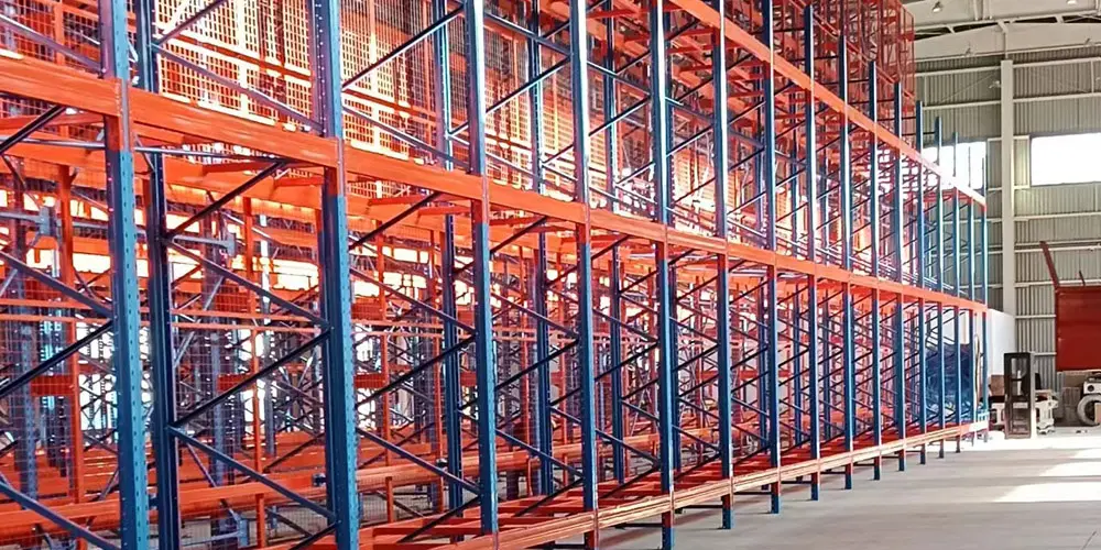 Push back racking with nested carts for multi-deep pallet storage