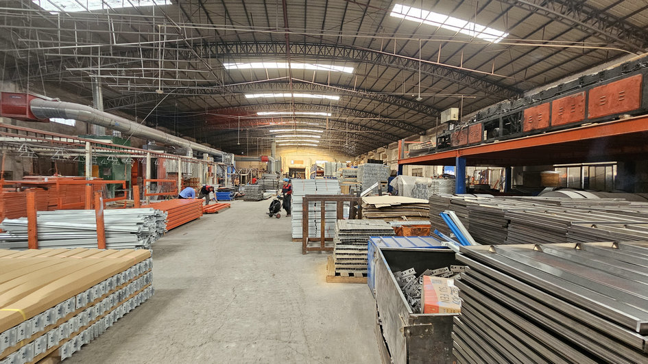 Industrial shelving system in manufacturing facility storage area