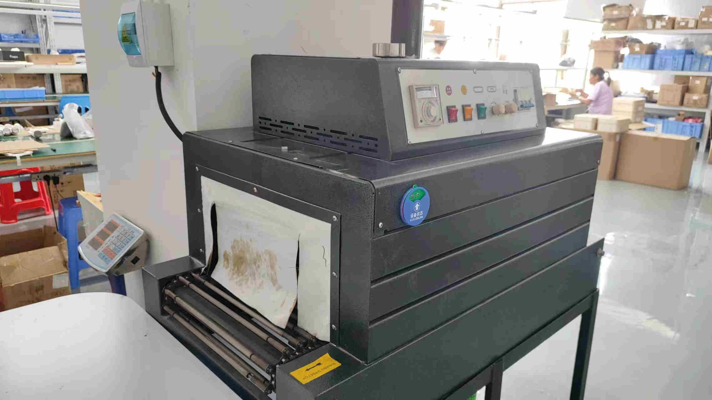 Shrink film packaging machine for beauty device protection