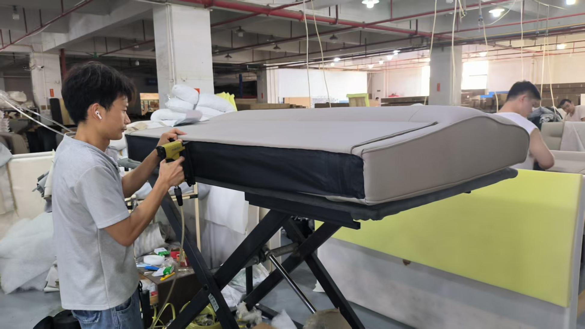 Final assembling stage of upholstered sofa at Hark Homes factory