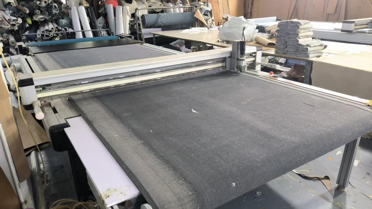 Automated fabric cutting machine at Hark Homes upholstery production