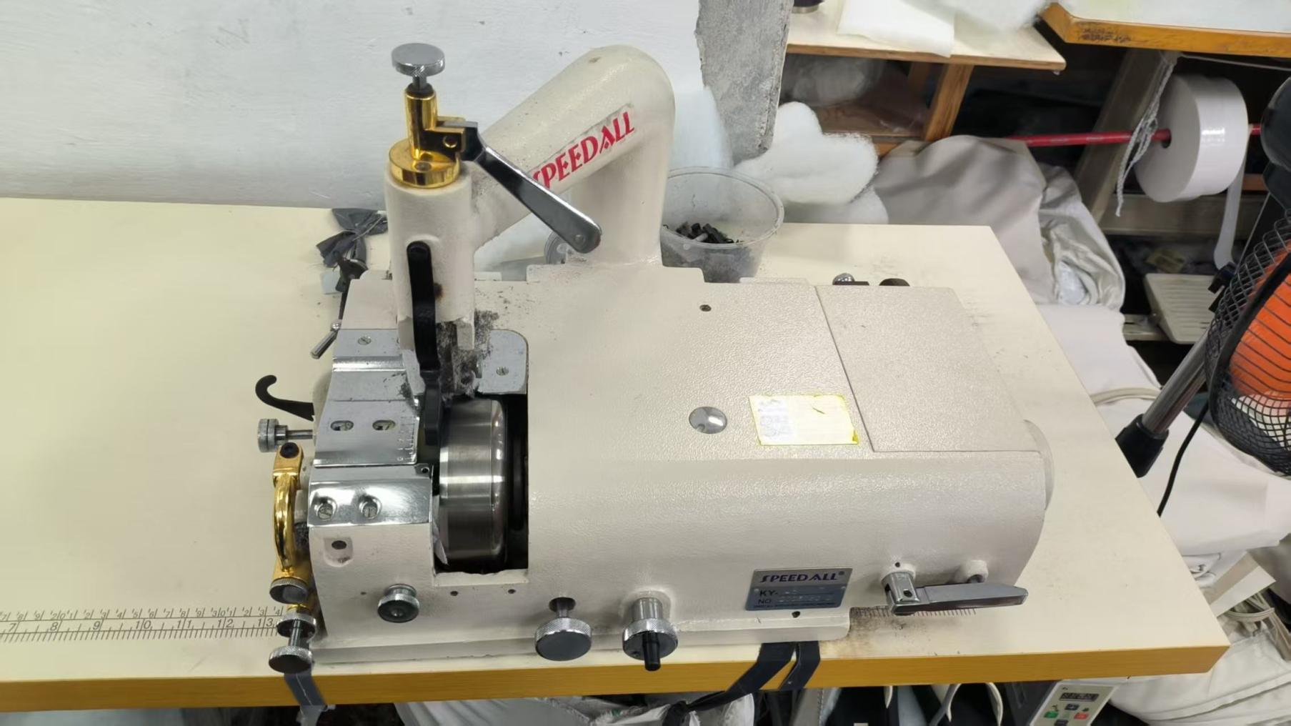 Tacking machine used for sofa and chair upholstery at Hark Homes