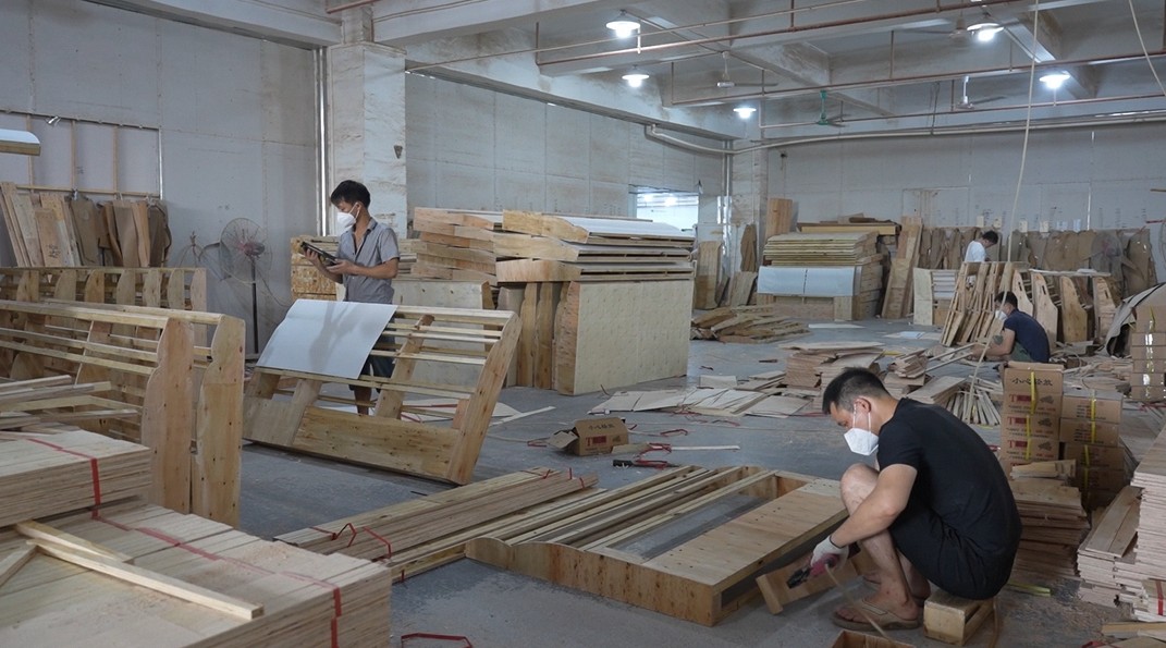 Wood processing and shaping at Hark Homes manufacturing facility