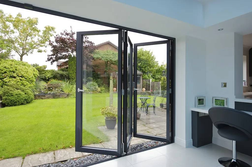 Aluminum Folding Glass Door System with Low Profile Tracks and High Efficiency Panels for Open Plan Designs