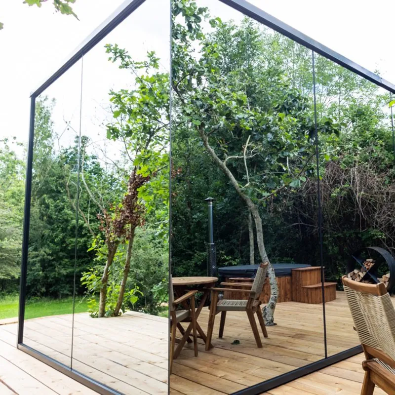 Glass Sunroom Cabin with Mirror Facade