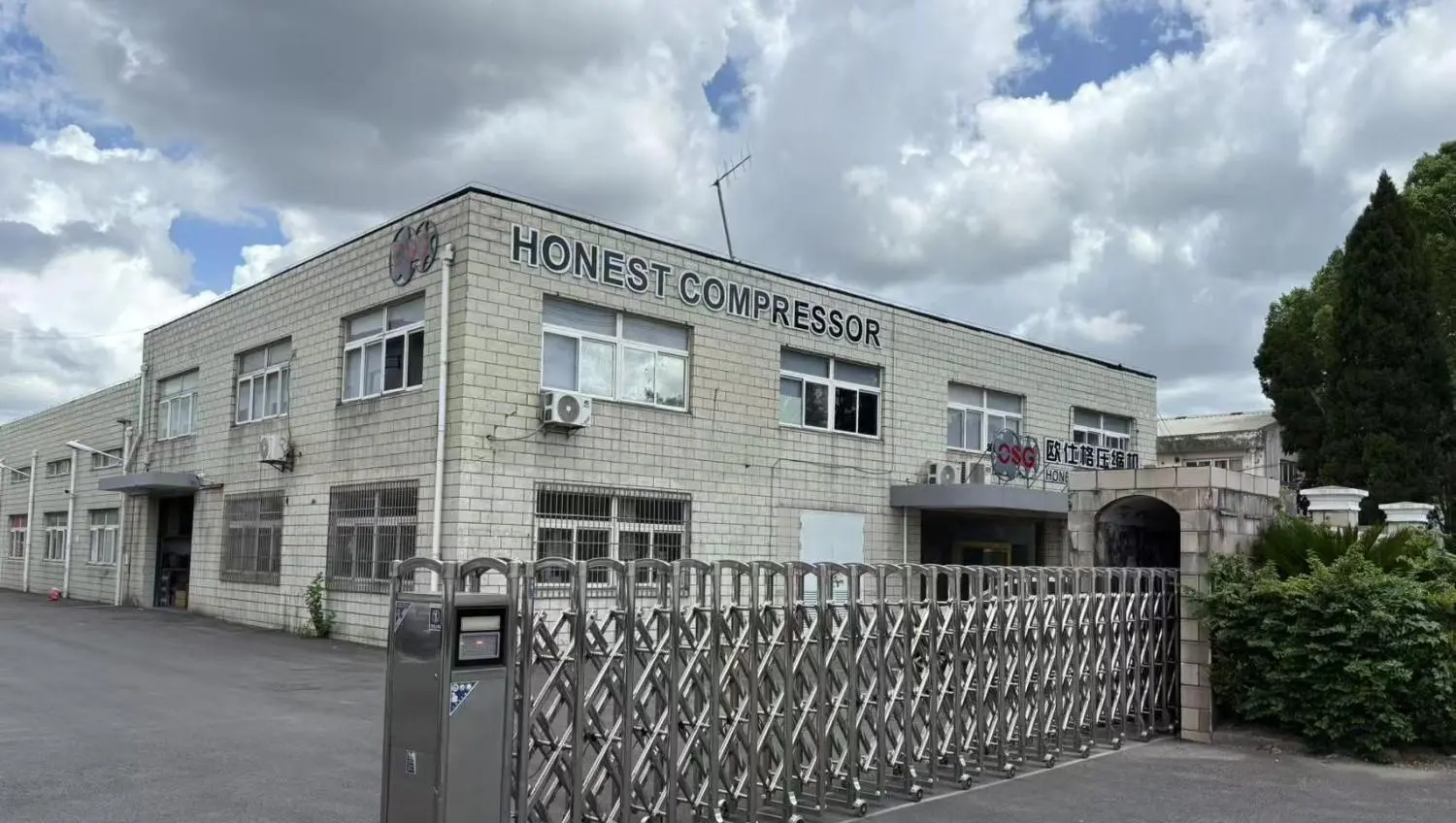 Engineer inspecting a screw air compressor unit