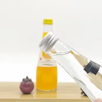 Cheap Wholesale 250ml 330ml Clear Glass Bottles Round Shape with Aluminum Lid & Screw Cap for Mineral Soda Water Crown Screen Printing Suppliers, Factories