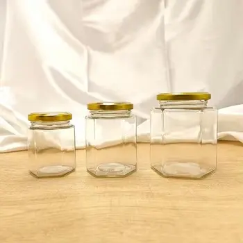 Cheap Mini Hexagon Glass Honey Jars 1.5 oz Party Favors with Dippers Lids for Jelly and Baby Food Suppliers, Manufacturer