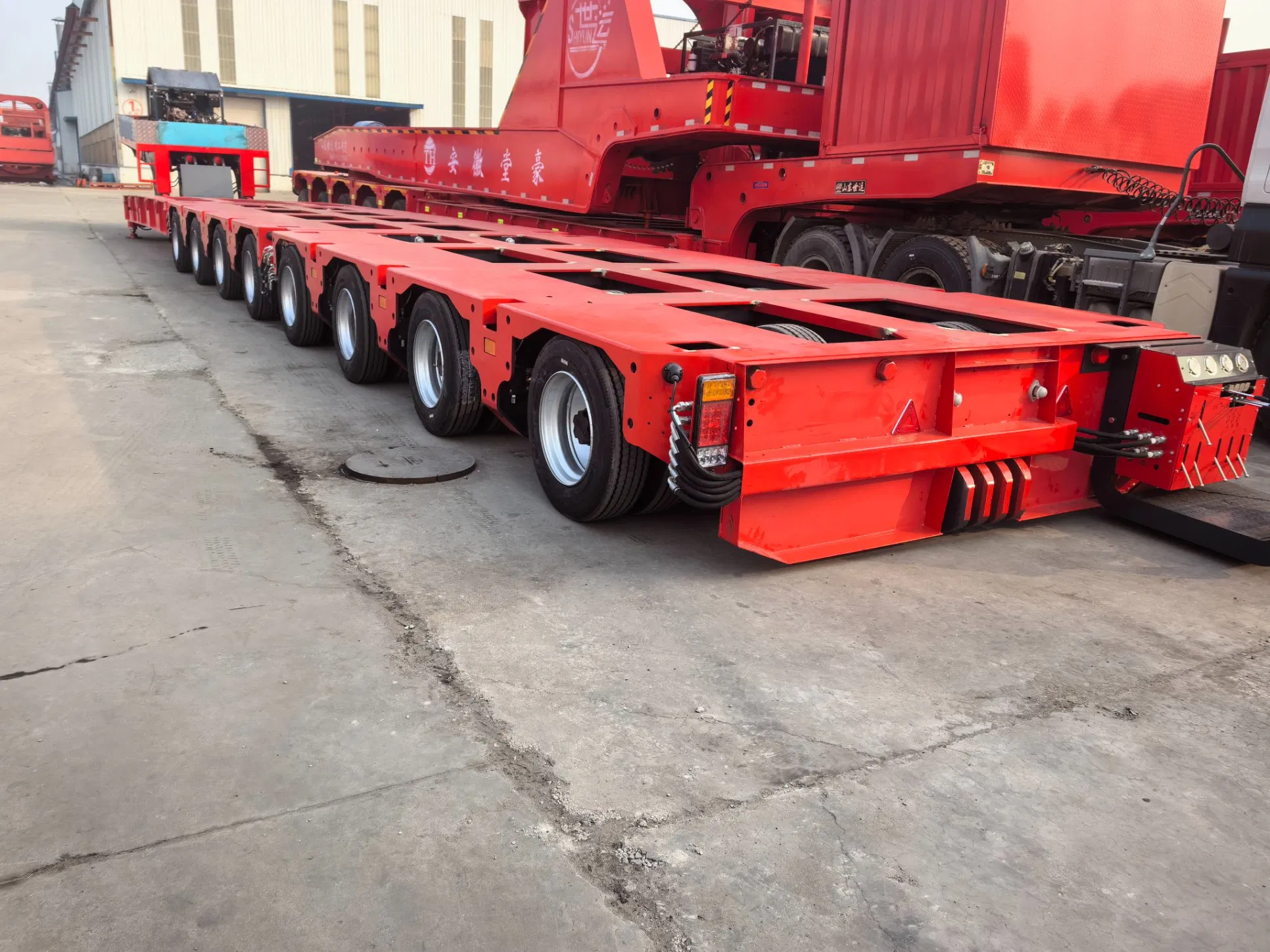 Made in China 300-Ton Hydraulic Steering Hydraulic Axle Automatic Steering Modular Transport Truck 12/16-Axis Heavy Equipment Trailer Nicholas Series Trailer