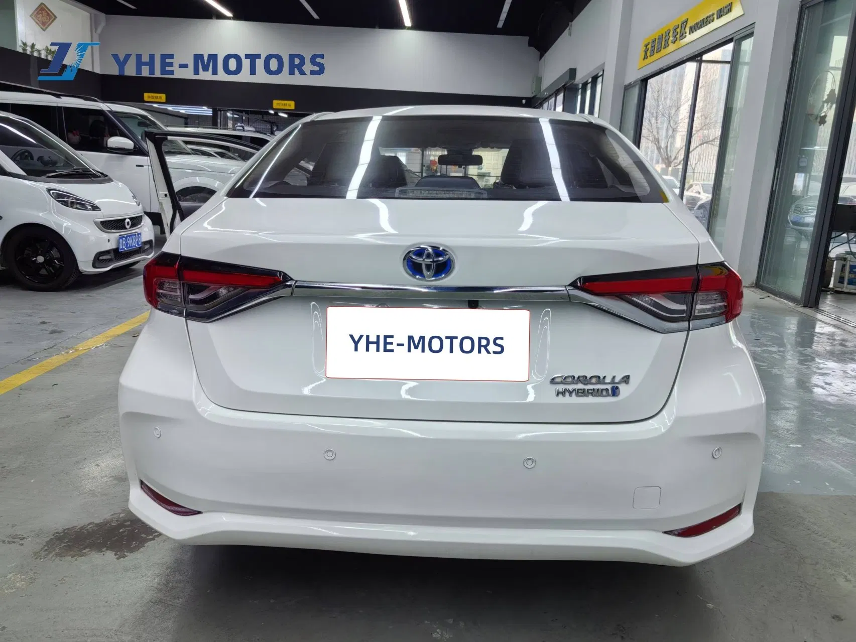 Vehículo familiar compacto eléctrico híbrido Toyota Corolla a precio de fábrica, venta caliente de coche eléctrico usado