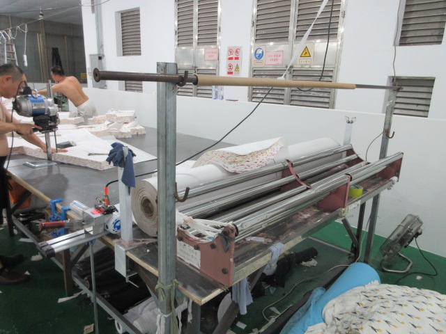 Industrial cutting machine for precision fabric cutting at Jedia Clothing