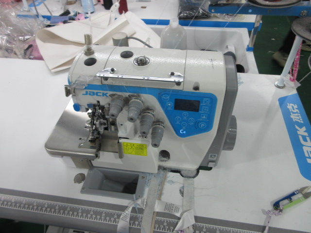 Specialized sewing machine equipment at Jedia garment manufacturing facility
