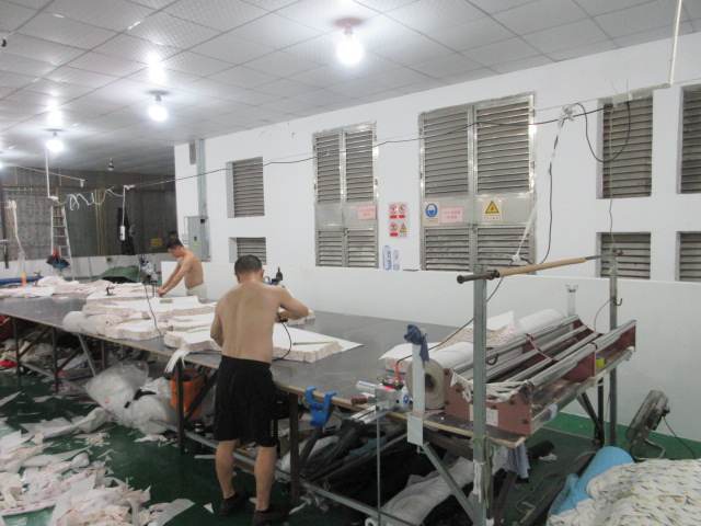 Garment fabric cutting process at Jedia Clothing factory