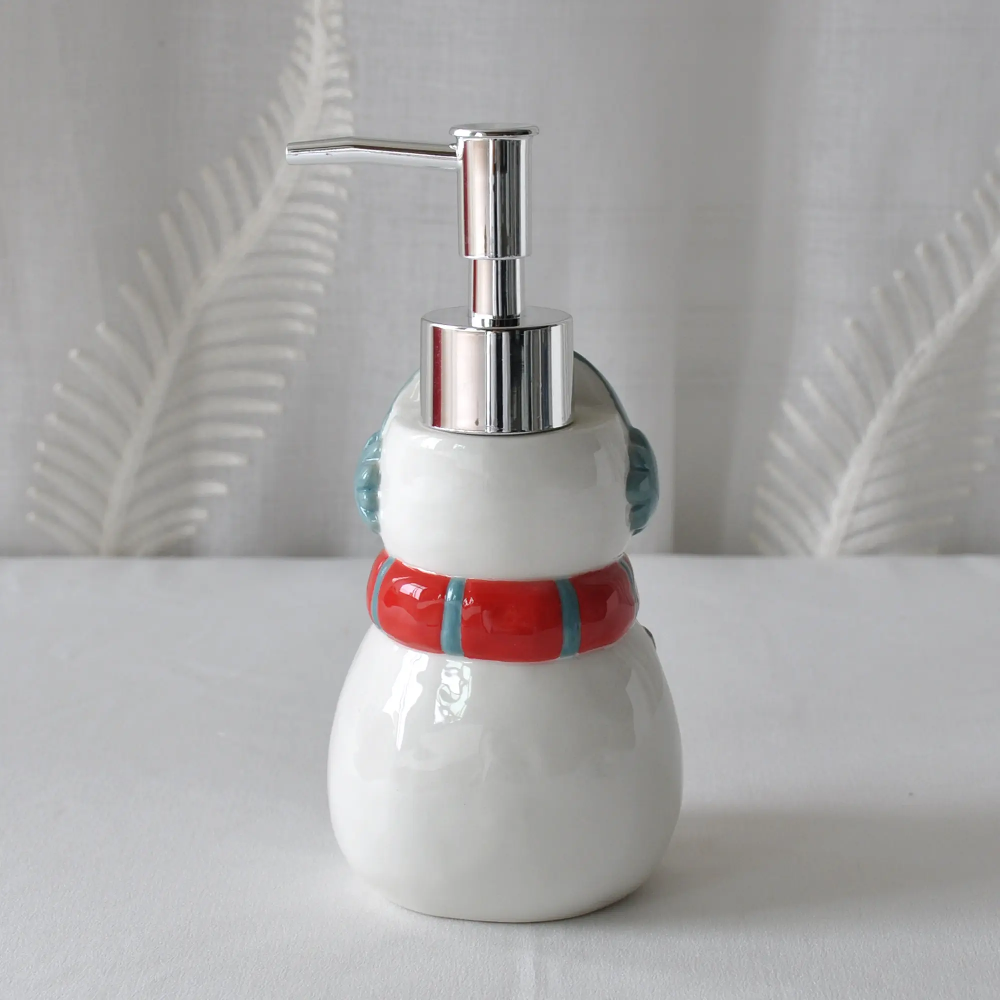 jiashun Christmas Snowman Ceramic Lotion Dispenser with Ear Muffs & Striped Scarf Exporters, Company