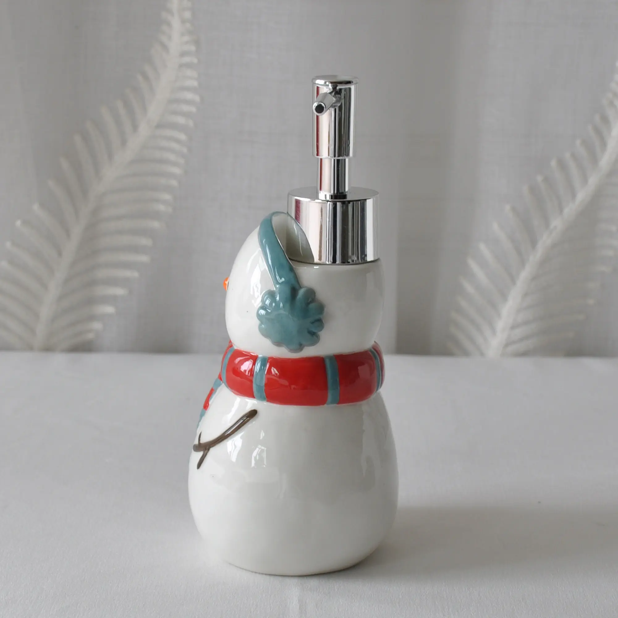jiashun Christmas Snowman Ceramic Lotion Dispenser with Ear Muffs & Striped Scarf Exporters, Company
