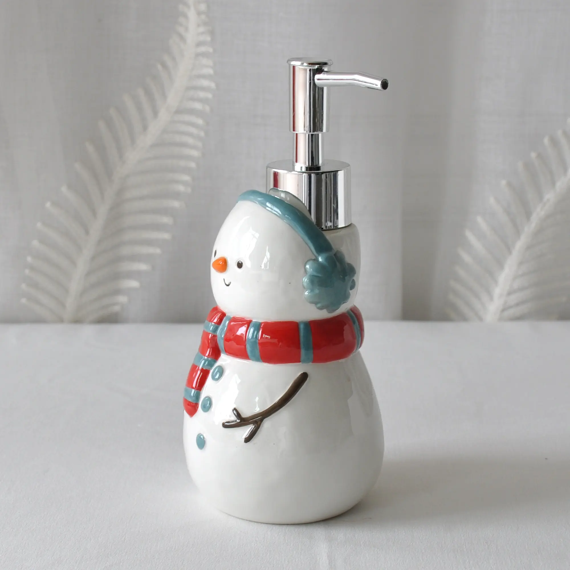 jiashun Christmas Snowman Ceramic Lotion Dispenser with Ear Muffs & Striped Scarf Exporters, Company