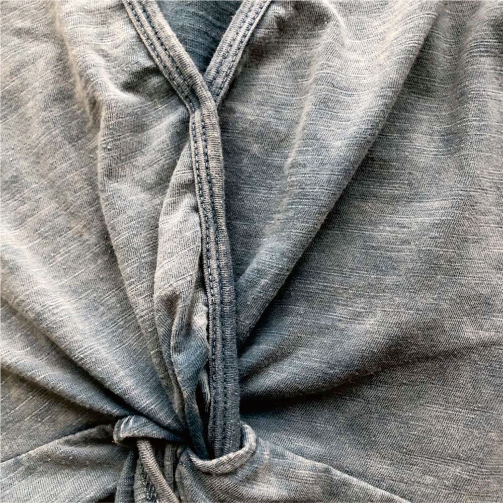 Garment post-processing technique including washing distressing and finishing treatments