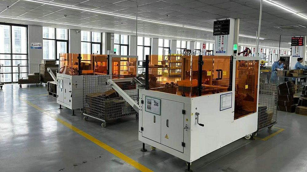Automated box opening machine in production