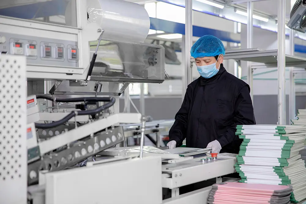 Step 7: Labeling and shrink wrapping — product label applied and fed into shrink-wrapping machine