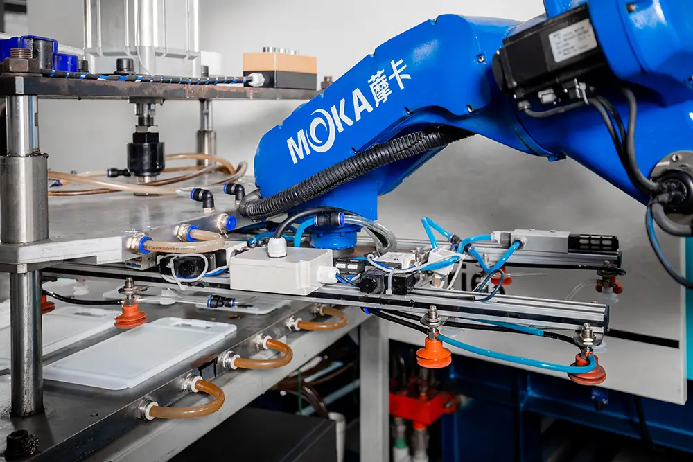Step 3: Product removal and transfer — robotic arm removes molded product and transfers to cooling unit