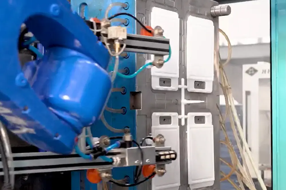 Step 2: Injection molding — blended materials loaded into injection molding machine with product mold