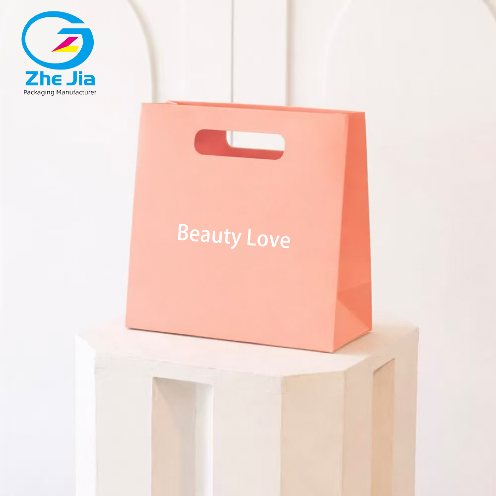 Luxury Custom Logo Fashion Die-Cut Handles Shopping Paper Bags Pink Die Cut Handle Make Up Printing Paper Bags Jewelry Packaging