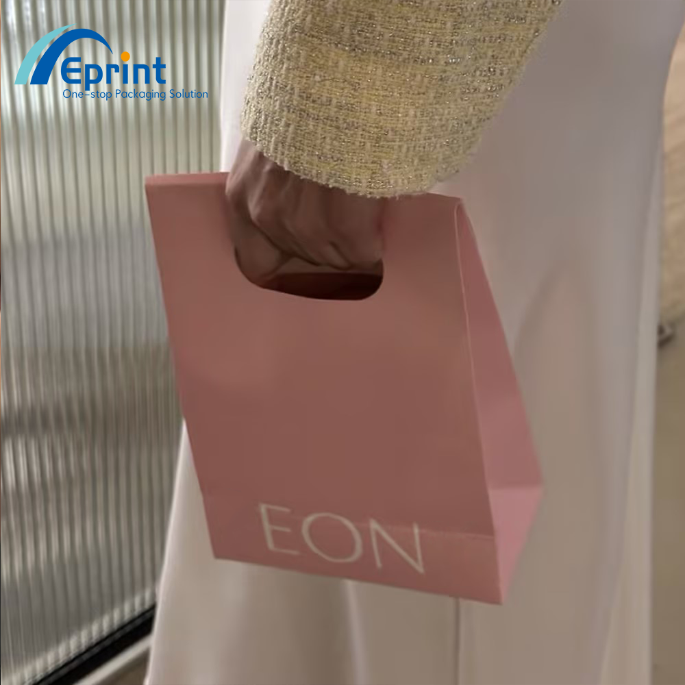 Luxury Custom Logo Fashion Die-Cut Handles Shopping Paper Bags With Sticker Pink Die Cut Handle Make Up Jewelry Packaging
