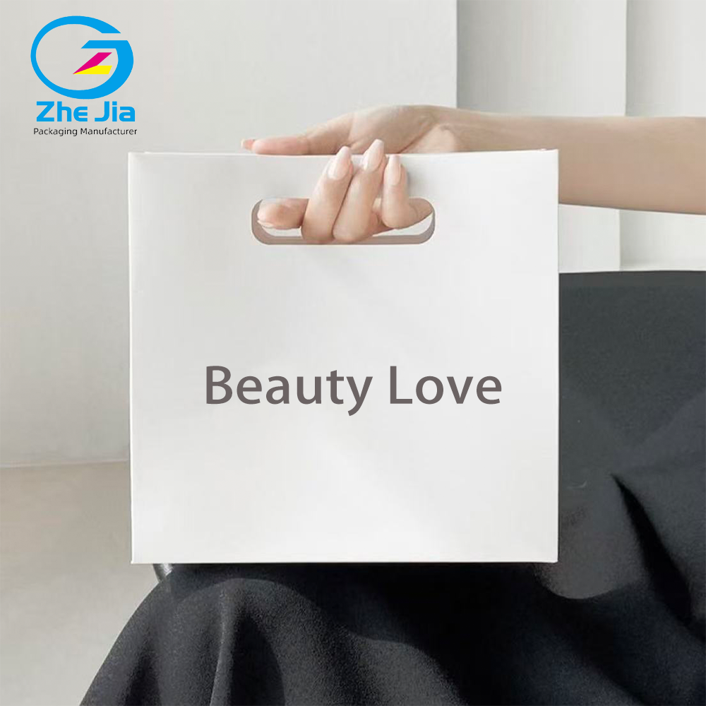 Luxury Custom Logo Fashion Die-Cut Handles Shopping Paper Bags Pink Die Cut Handle Make Up Printing Paper Bags Jewelry Packaging