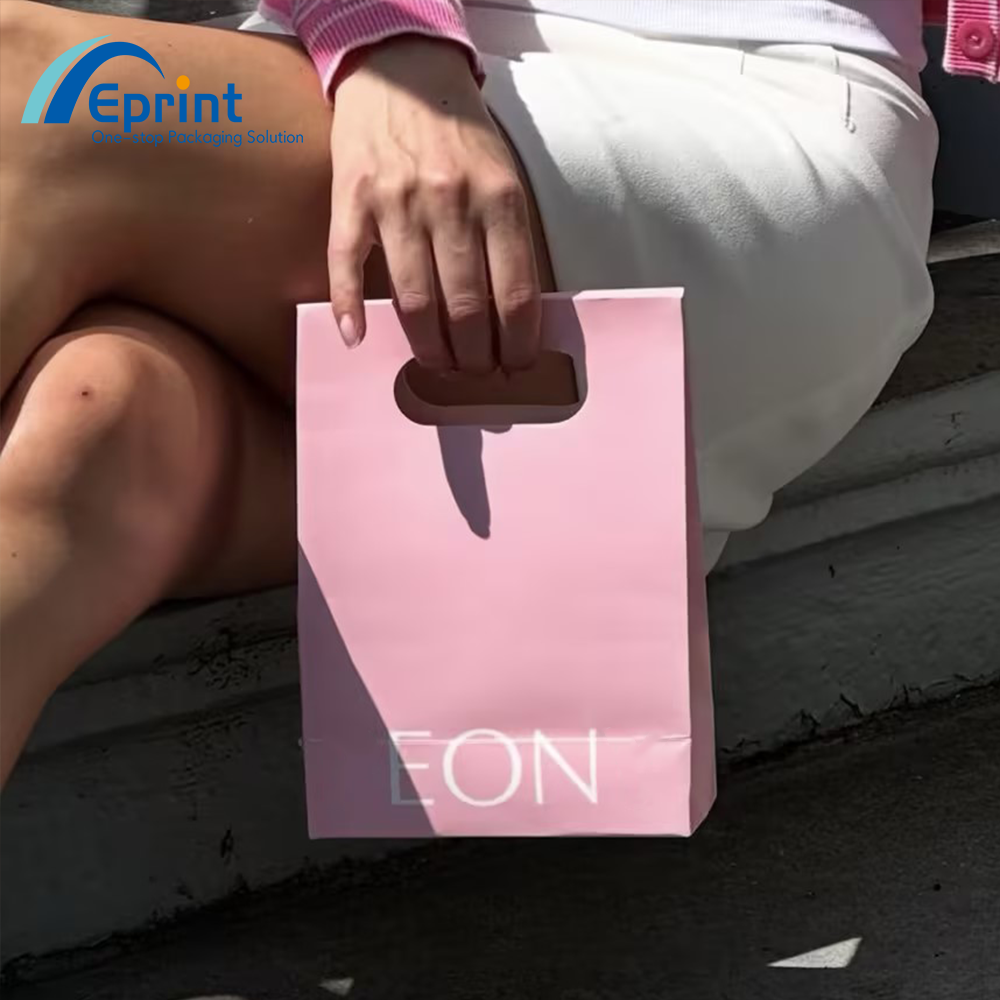 Luxury Custom Logo Fashion Die-Cut Handles Shopping Paper Bags With Sticker Pink Die Cut Handle Make Up Jewelry Packaging