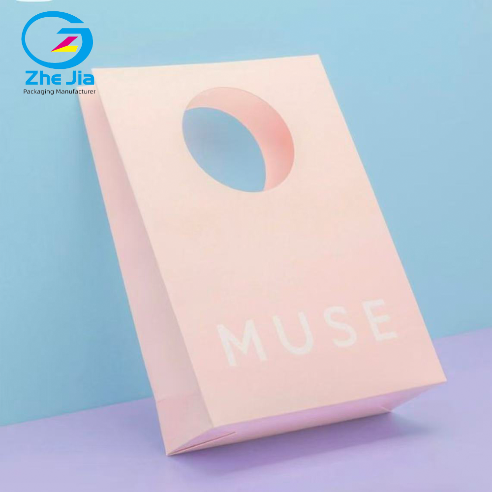 Luxury Custom Logo Fashion Die-Cut Handles Shopping Paper Bags Pink Die Cut Handle Make Up Printing Paper Bags Jewelry Packaging