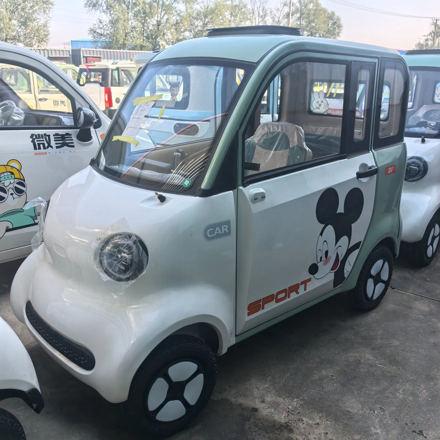 Smart Neighborhood Electric Vehicle with Auto Wiper and Reverse Camera