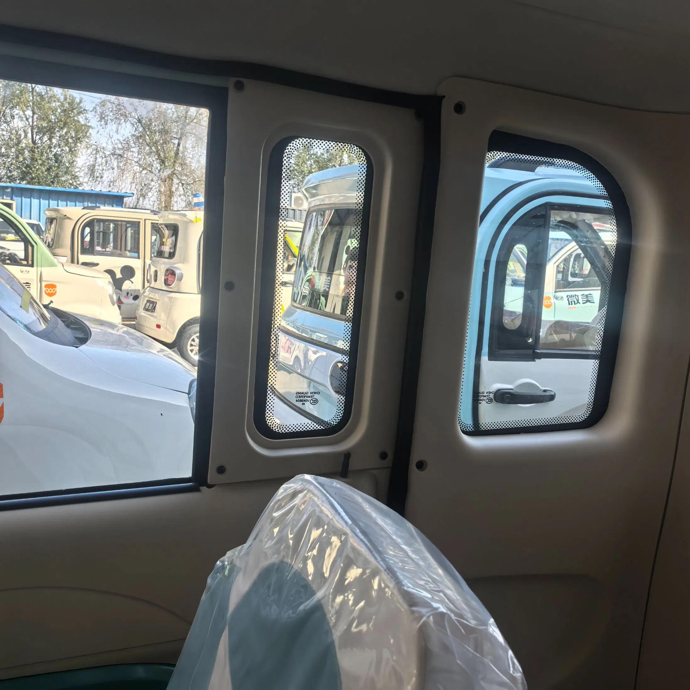 Smart Neighborhood Electric Vehicle with Auto Wiper and Reverse Camera