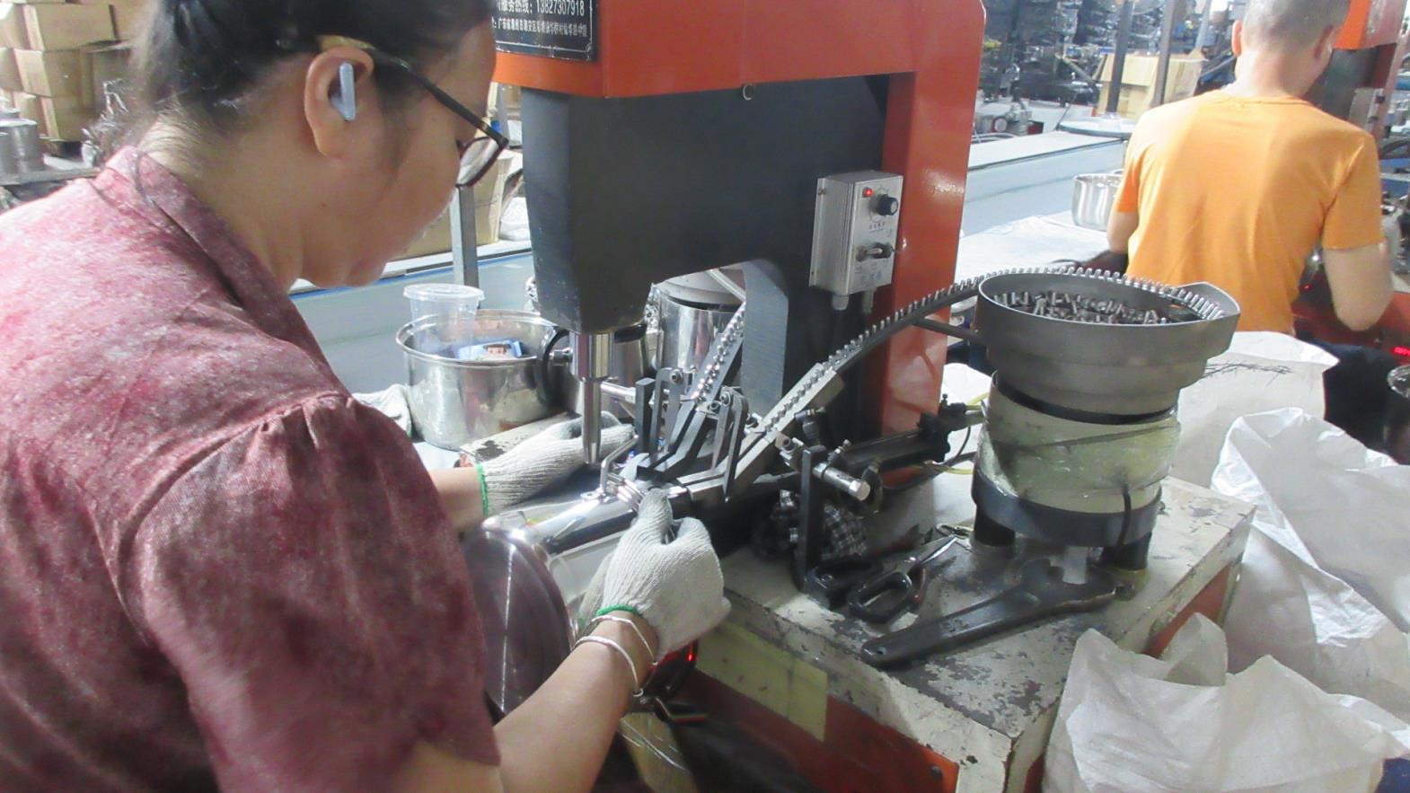 Riveting assembly process for stainless steel kitchenware handles and components at Kaus Kitchen