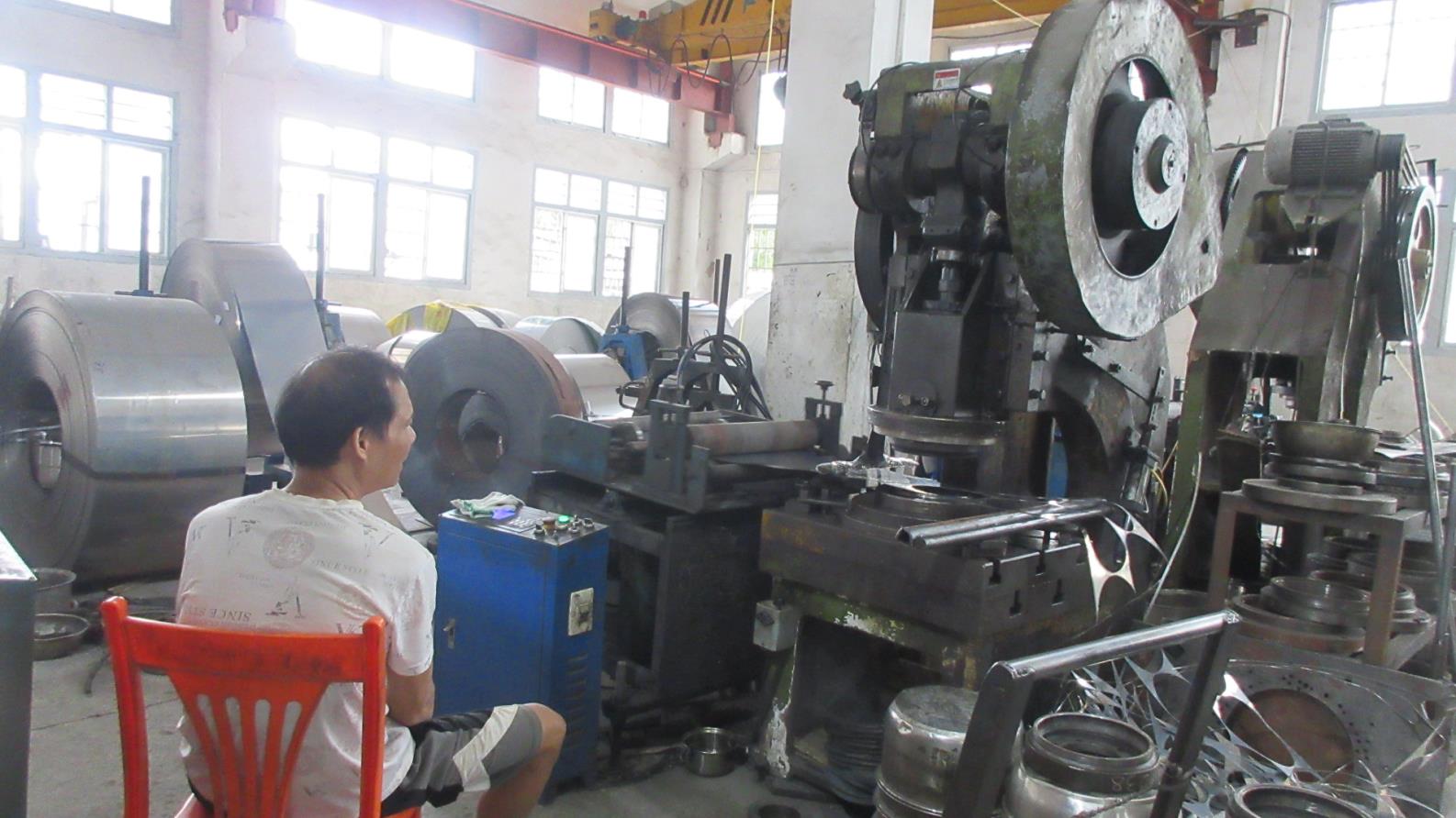 Advanced CNC cutting machine for precision stainless steel processing at Kaus Kitchen