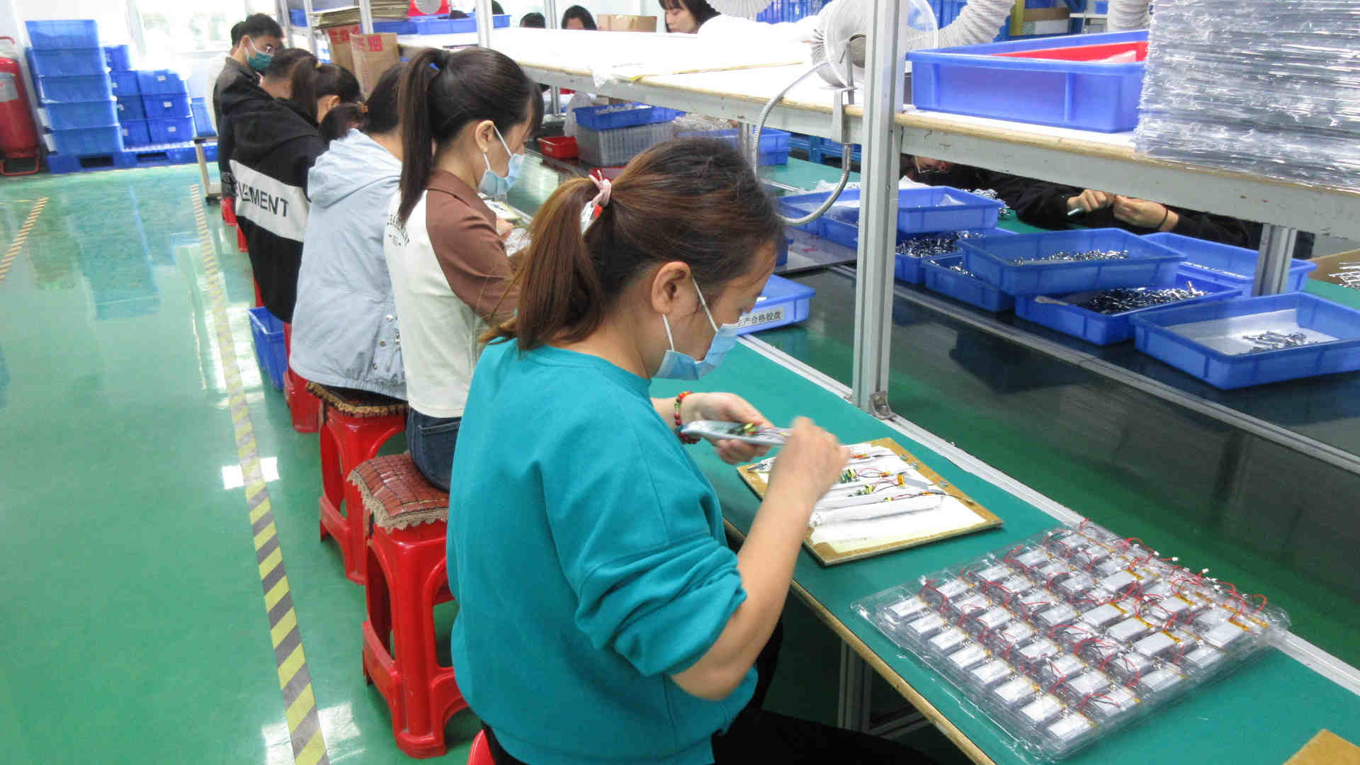 Kelli Beauty production assembly line workers assembling beauty devices in Foshan factory