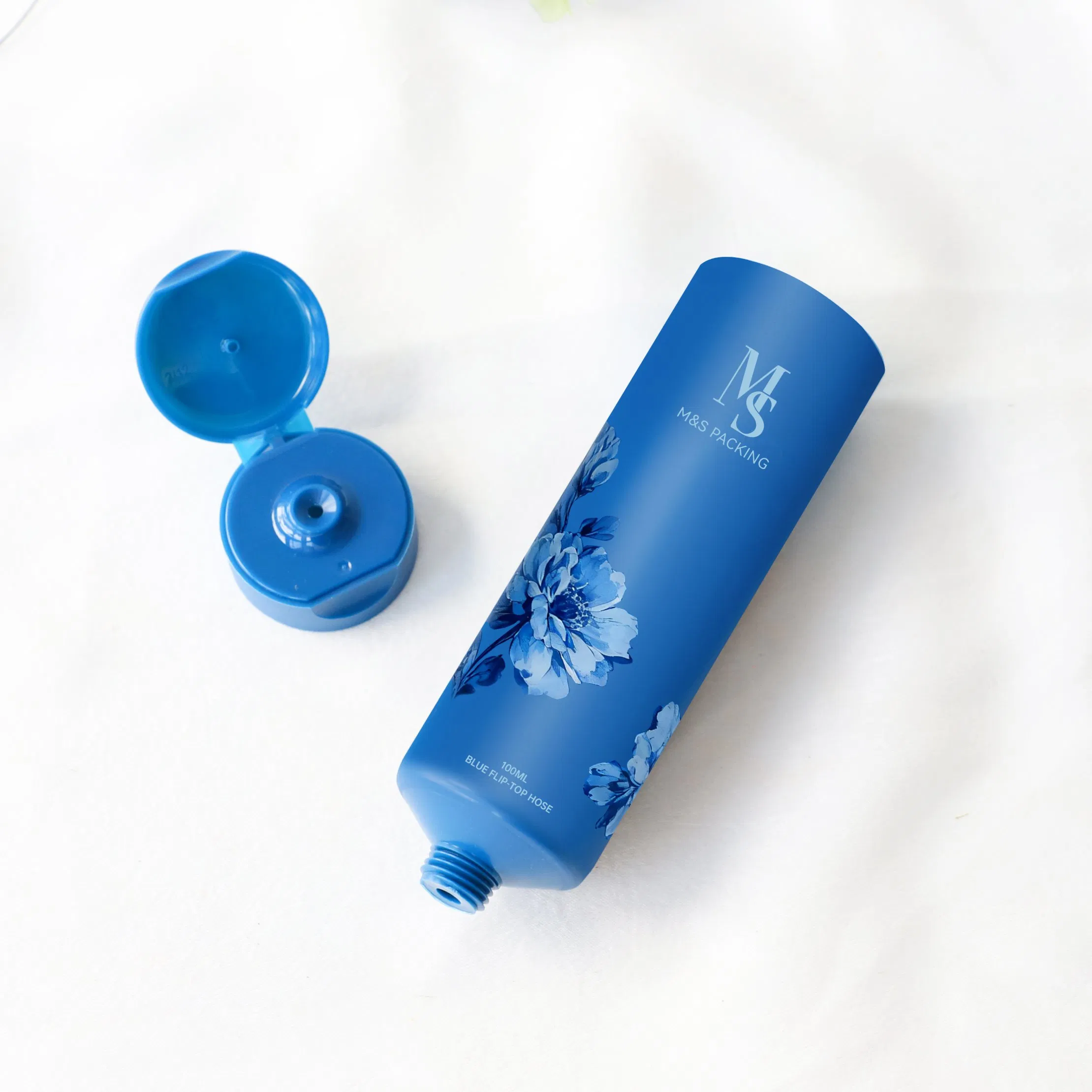 100ml أنبوب مرن قابل للضغط بغطاء أزرق لتعبئة مستحضرات التجميل والعناية بالبشرة
