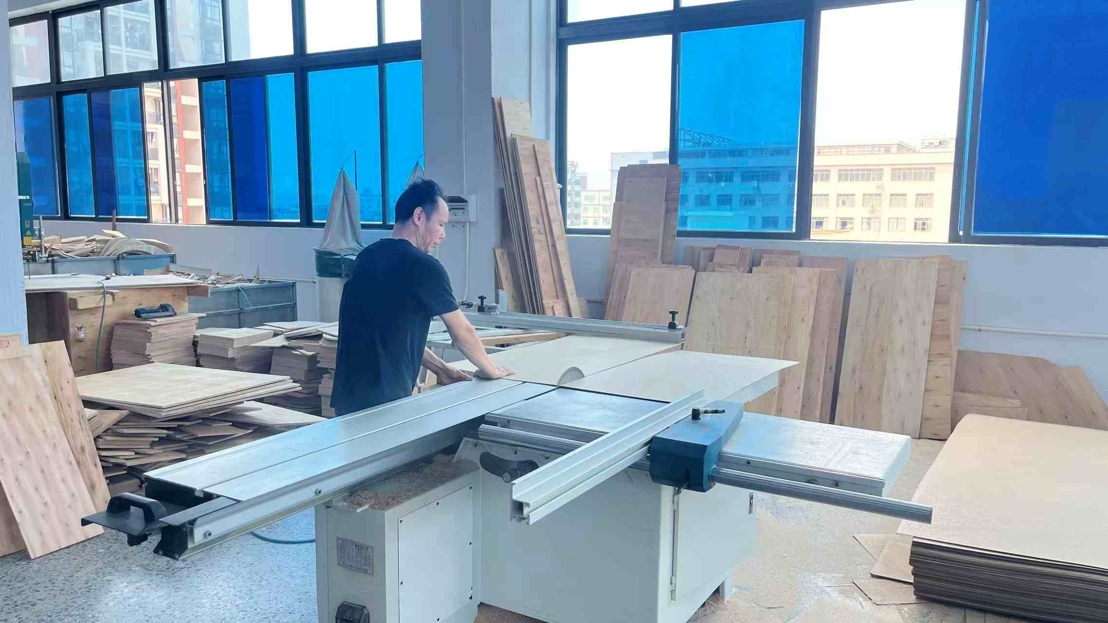 Precision wood cutting process in Kallos House furniture factory