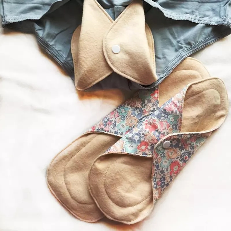 Absorvente menstrual reutilizável feminino respirável e lavável ecológico