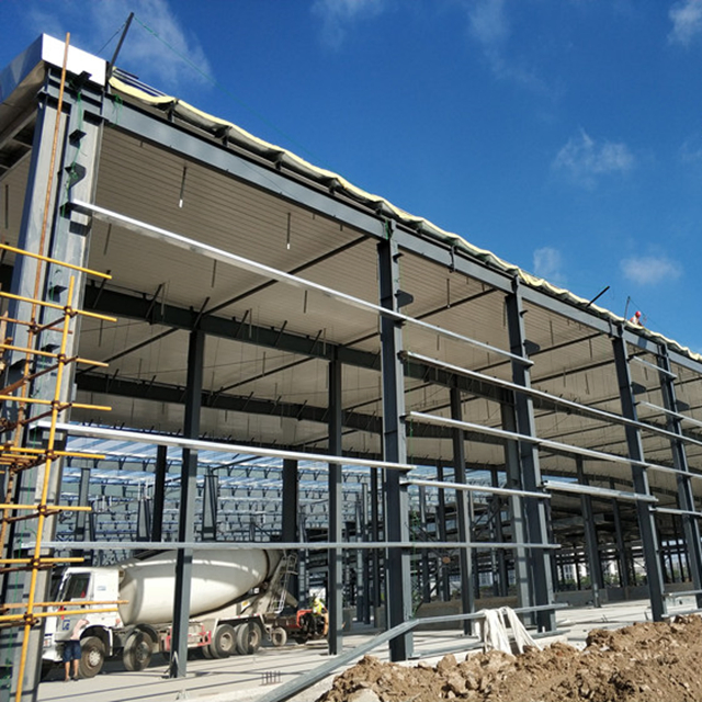 Design H Section Galvanized Metal Construction Prefab/Prefabricated Frame Industrial Building Workshop/Warehouse Steel Structure with Painted Sandwich Panel
