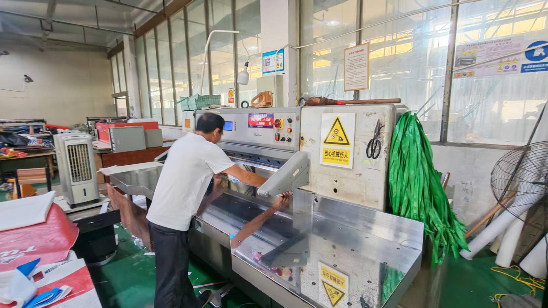 Industrial slitter machine at LAHD for precision fabric and ribbon slitting operations