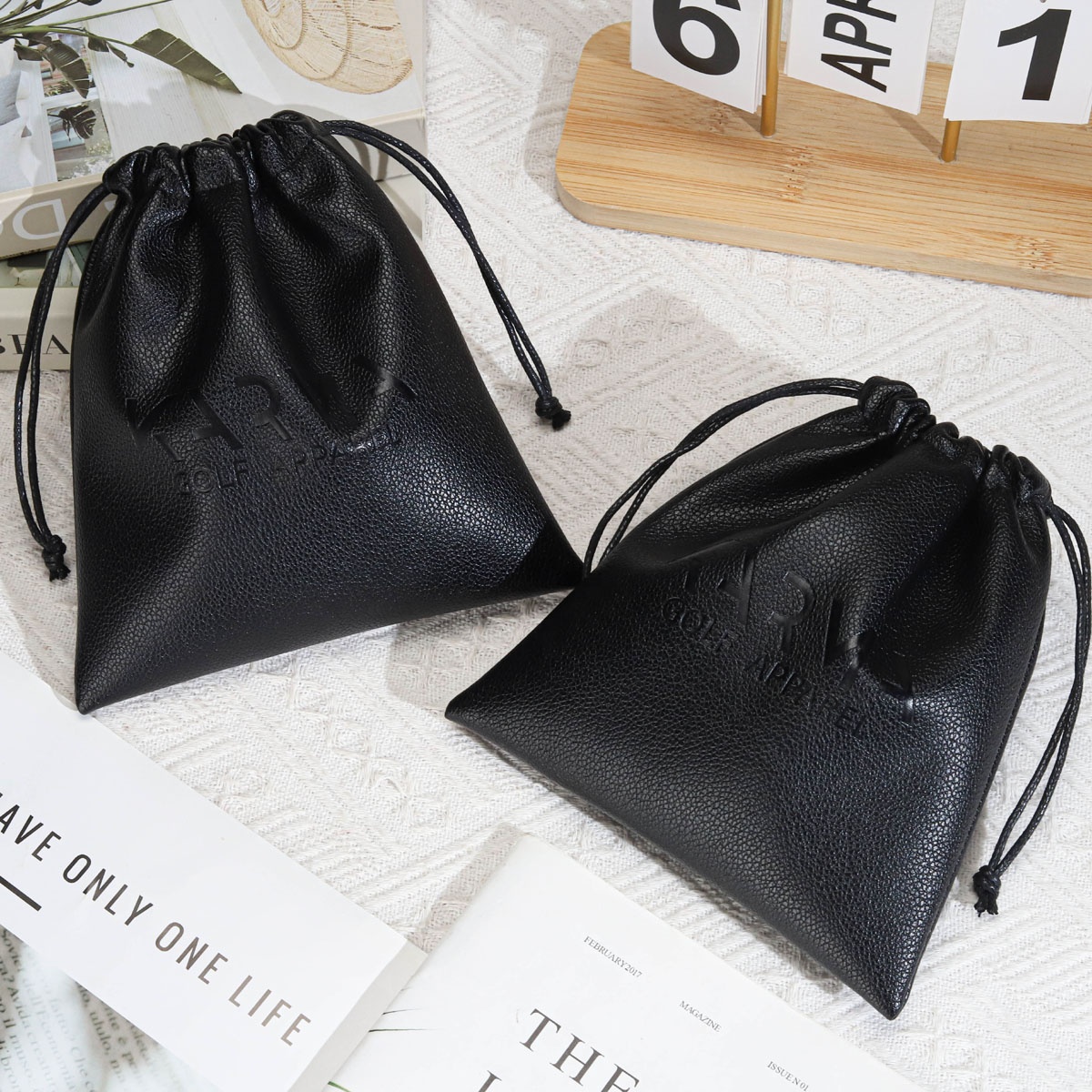 Custom Emboss Logo Black Leather Drawstring Bag for Power Bank Waterproof Pu Leather Cosmetic Makeup Packaging Pouch