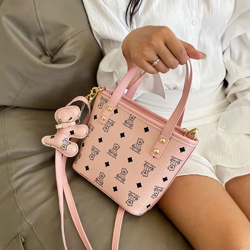 Nueva bolsa de diseñador de textura de nicho, tipo cubo, de mano, a juego, para mujer, bandolera de un solo hombro