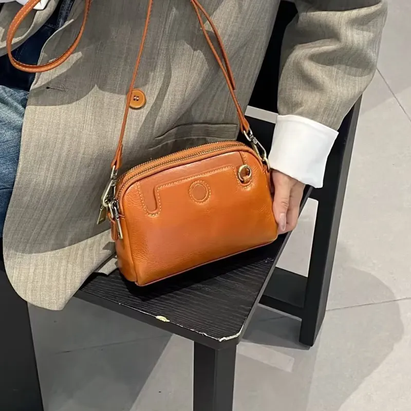 Diseño clásico de múltiples bolsillos bolso hobo casual para damas de cuero genuino