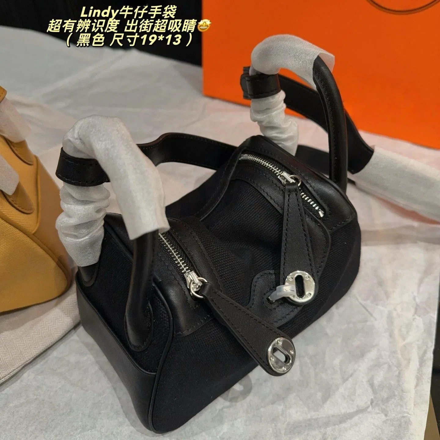 Bolso de mano mini Lindy de lujo en lona y cuero Tamaño 19*13cm Dos colores amarillo y negro con herrajes de cierre de giro plateados, asa superior, bandolera, bolso de mujer, cartera de dama