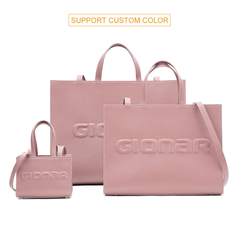 2023 Bolso de mano vegano de calidad personalizada de marca de moda con logo en relieve, bolso de lujo grande negro de cuero genuino para mujeres