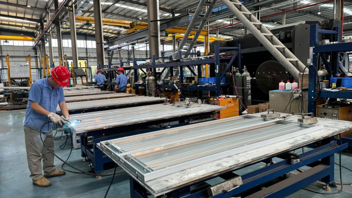 DHI Lift welding process — robotic and manual welding for elevator frames